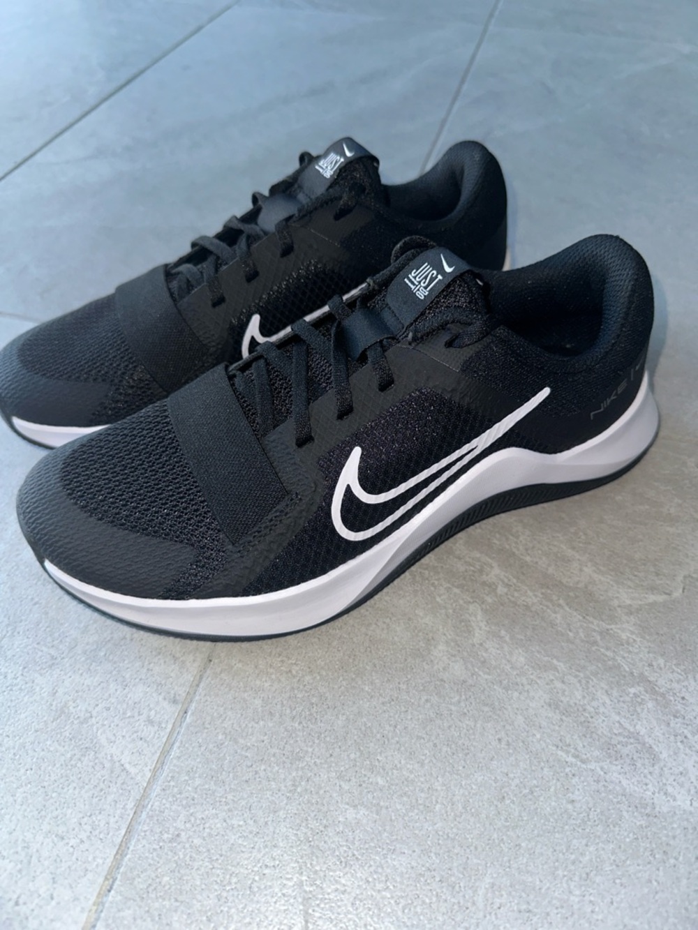 Nike Black Athletic Shoes with White Swoosh